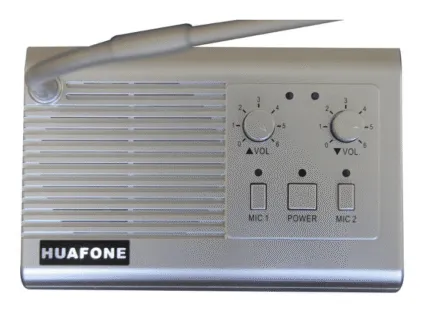 Silver Avio Technologies master station intercom with a gooseneck microphone, two volume dials, and MIC1/Power/MIC2 buttons.
