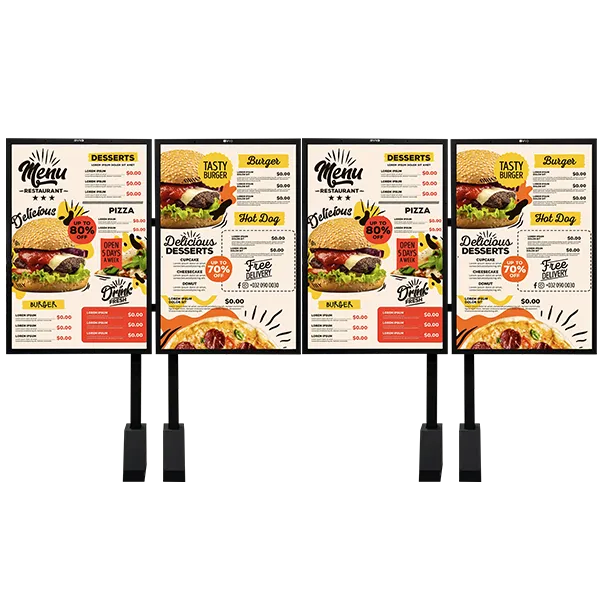 Wide Double MB 1 600x600 (1) - Avio Technologies Four outdoor digital menu board posts side by side, each displaying a restaurant menu with burger, pizza, and dessert sections and pricing.