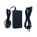 Black power adapter with coiled input and output cables and plugs.