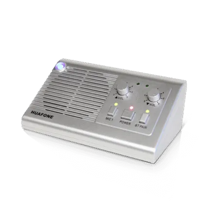 Silver Avio Technologies master station intercom with volume dials, a glowing power indicator, and Bluetooth pairing button.