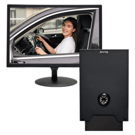 Monitor shows a smiling woman driving a car, with a black safe featuring a combination dial in front of it.